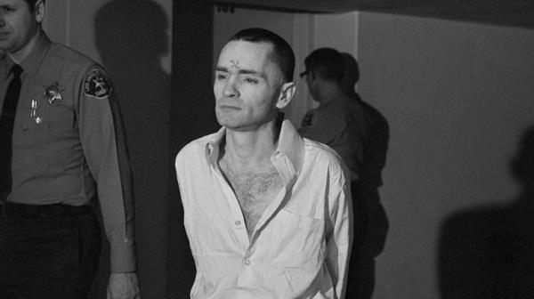 Shaven Charles Manson under police custody