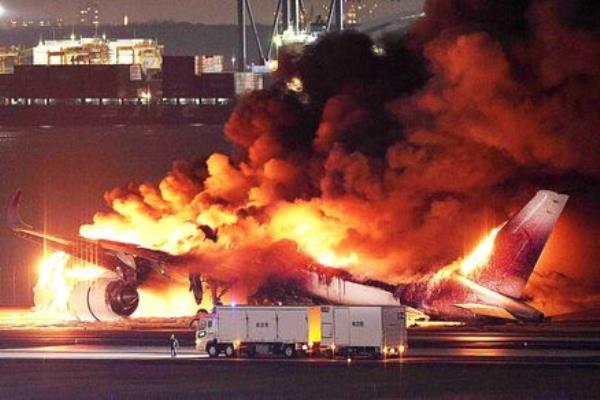 A Japan Airlines plane is on fire on the runway of Tokyo’s Haneda airport. Picture: STR/JIJI PRESS/AFP via Getty Images